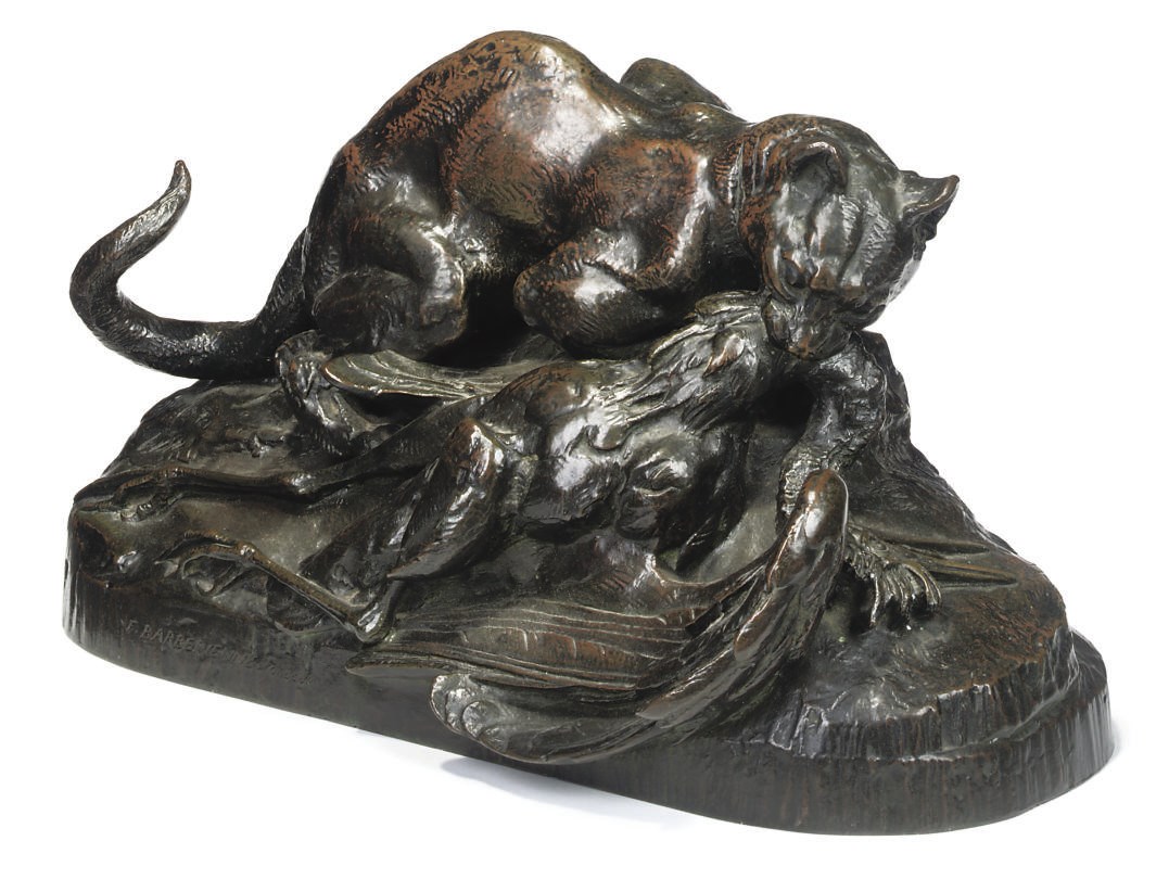 A FRENCH BRONZE OF AN OCELOT CARRYING A HERON