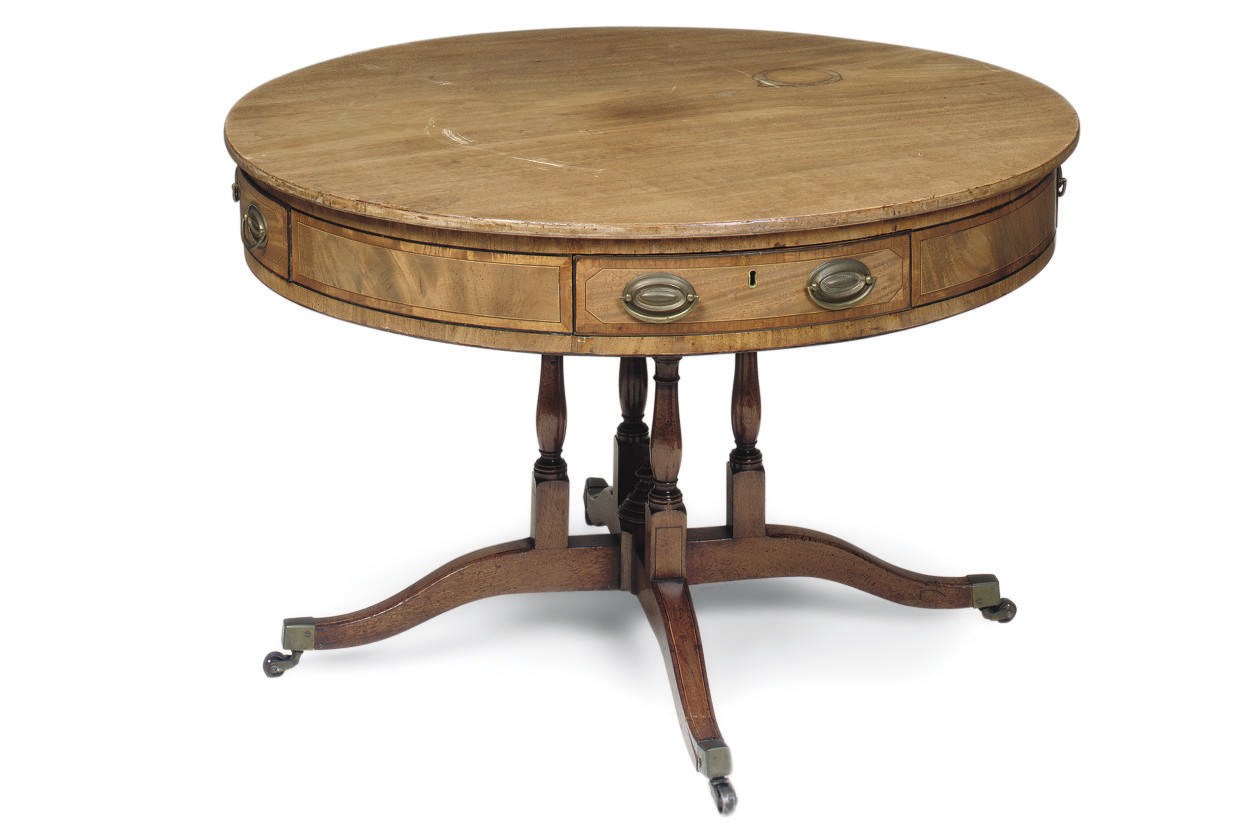 A REGENCY MAHOGANY LINE INLAID DRUM TABLE