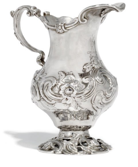 AN EARLY GEORGE III ROCOCO SILVER CREAM JUG