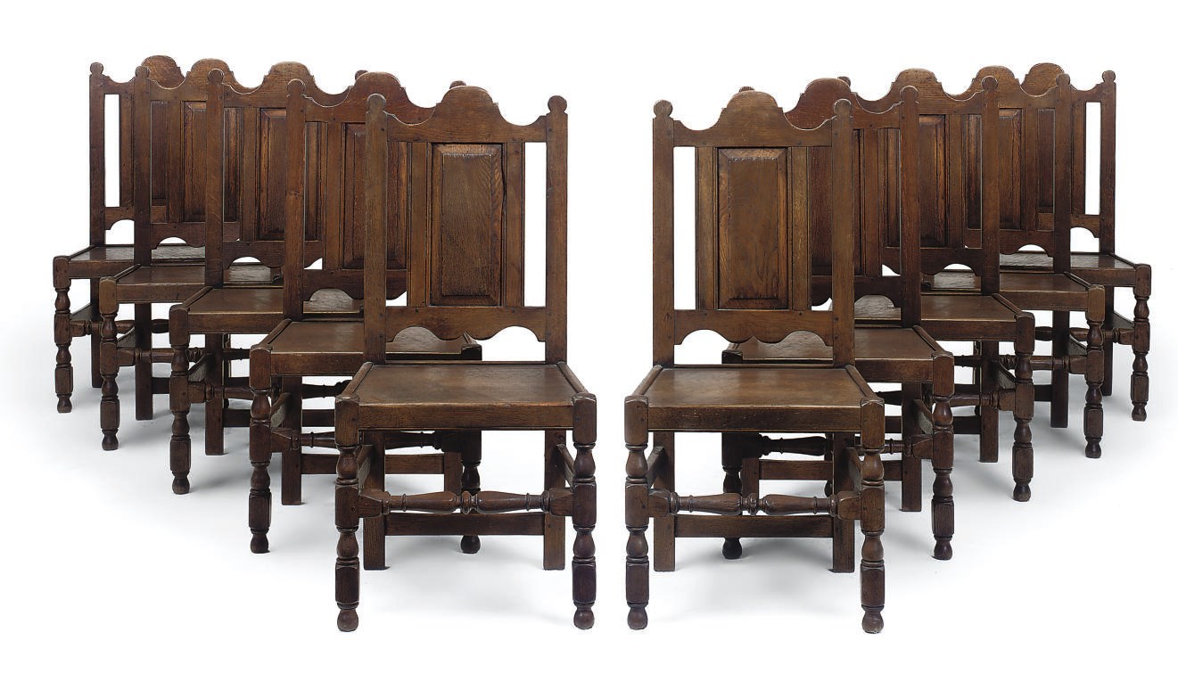 A SET OF TEN SOLID SEAT CHAIRS