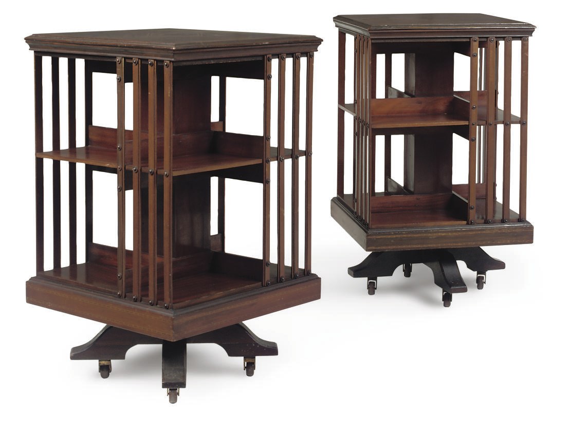 A PAIR OF EDWARDIAN MAHOGANY REVOLVING BOOKCASES