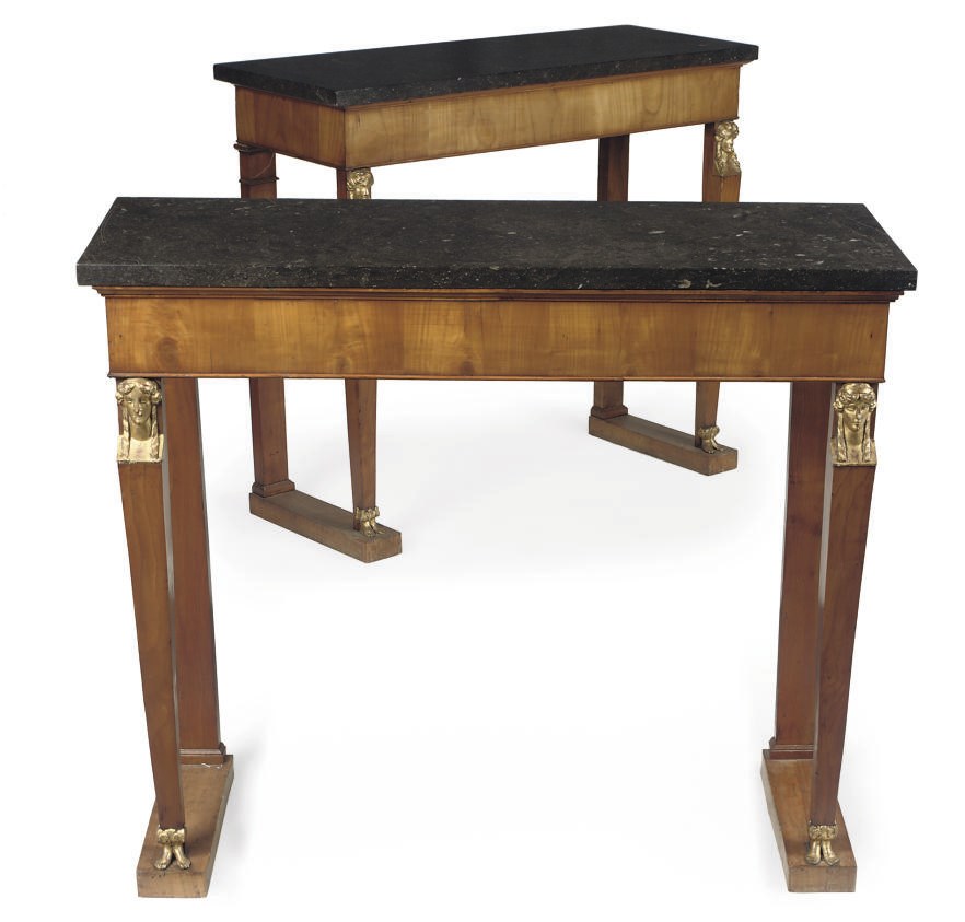 A PAIR OF NORTH EUROPEAN FRUITWOOD AND PARCEL-GILT CONSOLES