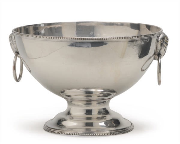 A LARGE SILVER-PLATED PEDESTAL BOWL WITH RAM'S HEAD-FORM HANDLES,