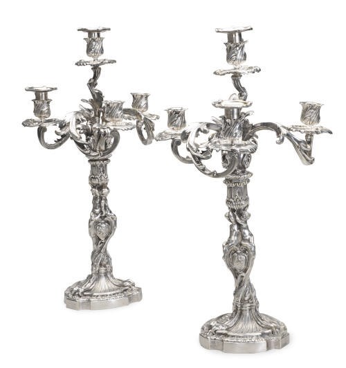 A PAIR OF CONTINENTAL SILVER-PLATED FOUR-LIGHT CANDELABRA,