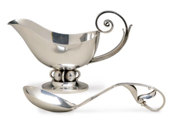 AN AMERICAN SILVER SAUCE-BOAT AND A DANISH SILVER LADLE,