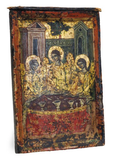 A RUSSIAN GILTWOOD PAINTED ICON OF CHRIST PANTOCRATOR AND TWO OTHER SAINTS,