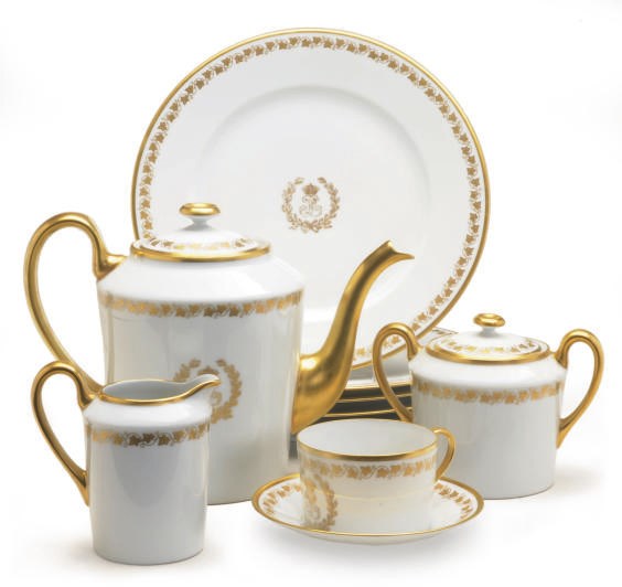 A SEVRES-STYLE GILT WHITE PORCELAIN DINNER AND COFFEE SERVICE,
