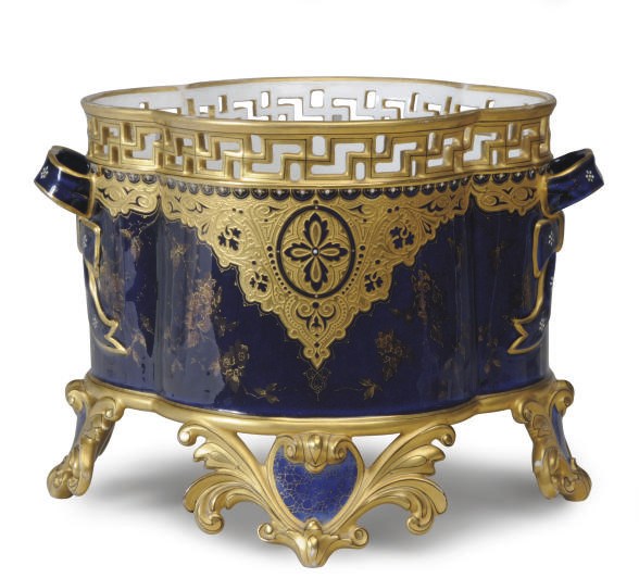 A CONTINENTAL COBALT BLUE-GROUND TWO-HANDLED RETICULATED QUATREFOIL-FORM JARDINIERE,