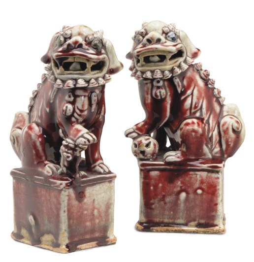 A PAIR OF CHINESE PORCELAIN COPPER RED MODELS OF BUDDHISTIC LIONS,