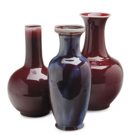 A GROUP OF SEVEN CHINESE PORCELAIN FLAMBE AND COPPER RED VASES,
