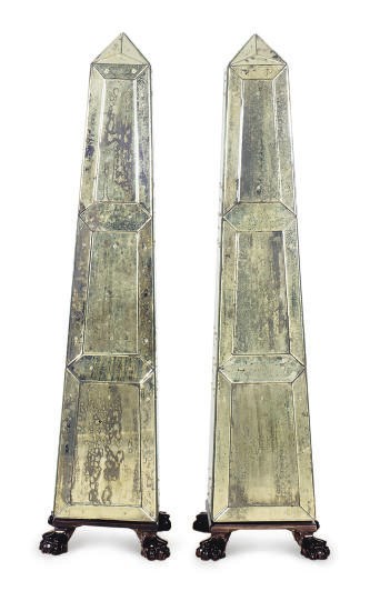 A PAIR OF EBONIZED AND MIRRORED OBELISKS,