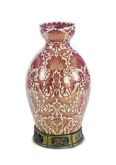 A CONTINENTAL GLAZED CERAMIC JARDINEIRE,