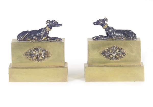 A PAIR OF PATINATED BRONZE AND GILT-METAL FIGURAL BOOKENDS,