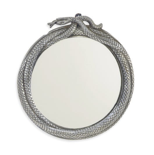 A SILVERED METAL SERPENT-FORM CIRCULAR OVER-DOOR MIRROR,