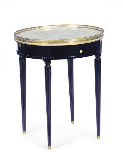 AN EBONIZED AND MARBLE-TOP GUERIDON,