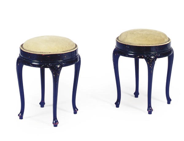 A PAIR OF EBONIZED AND LEATHER-UPHOLSTERED STOOLS,