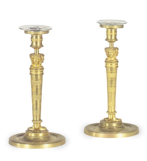 A PAIR OF CONTINENTAL GILT-METAL CANDLESTICKS,
