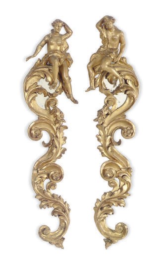 A PAIR OF GILTWOOD SCROLL-FORM FIGURAL MIRRORS,