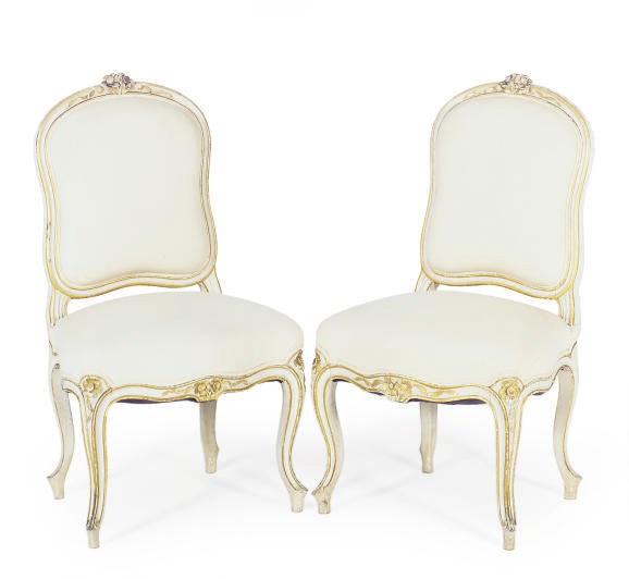 A PAIR OF FRENCH WHITE-PAINTED AND PARCEL-GILT SIDE CHAIRS,
