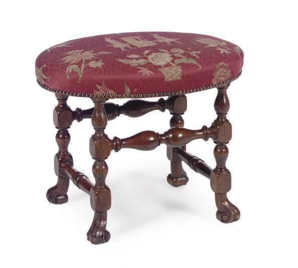 A CONTINENTAL FRUITWOOD AND UPHOLSTERED OVAL STOOL,