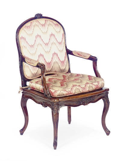 A LOUIS XV WALNUT, CANED AND UPHOLSTERED FAUTEUIL,