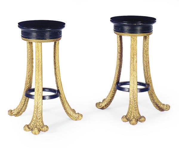A PAIR OF EBONIZED AND PARCEL-GILT TORCHERES,