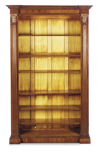 A CARVED AND STAINED WALNUT OPEN BOOKCASE,