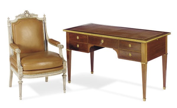 A FRENCH GILT-METAL MOUNTED MAHOGANY BUREAU PLAT TOGETHER WITH A GREY-PAINTED FAUTEUIL,