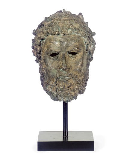 A PATINATED BRONZE ROMAN FIGUREHEAD,