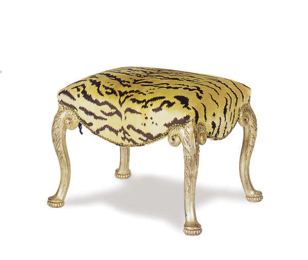 A CARVED GILTWOOD STOOL,
