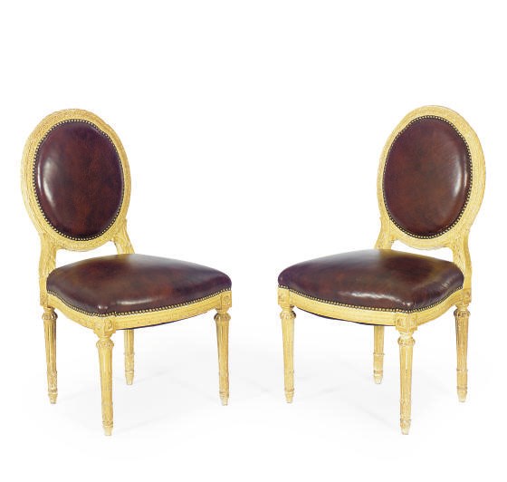 A SET OF FOUR ENGLISH CREAM-PAINTED DINING CHAIRS,