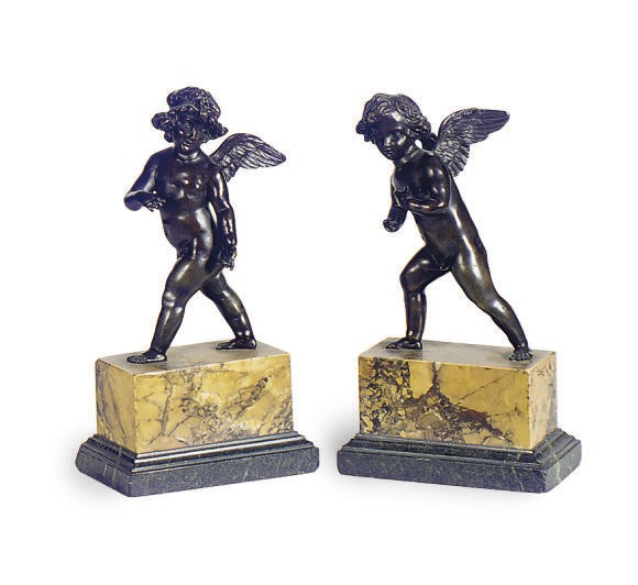 A PAIR OF PATINATED BRONZE FIGURES OF WINGED PUTTI,