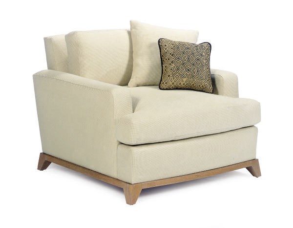 A PAIR OF OAK AND UPHOLSTERED LOUNGE CHAIRS,