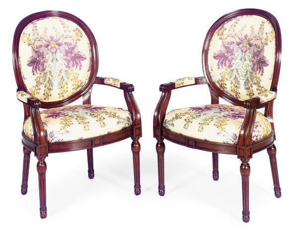 A SET OF EIGHT WALNUT AND UPHOLSTERED ARMCHAIRS,