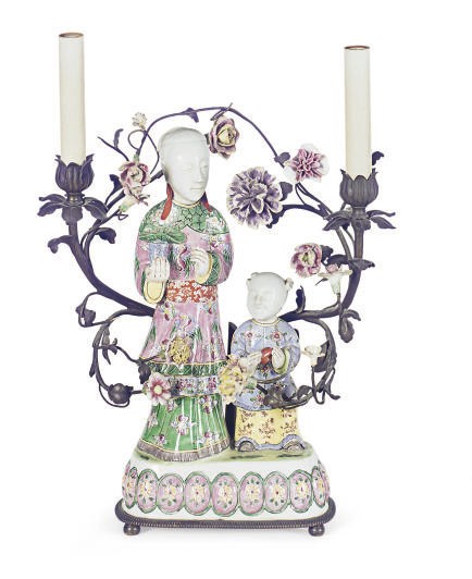 A GILT-METAL MOUNTED FAMILLE VERTE FIGURAL TWO-LIGHT CANDELABRA,