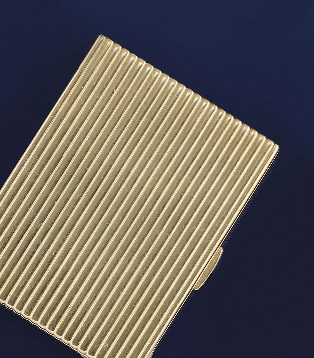 A 9ct. gold compact, by Cartier