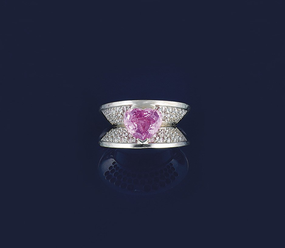 A pink sapphire and diamond ring