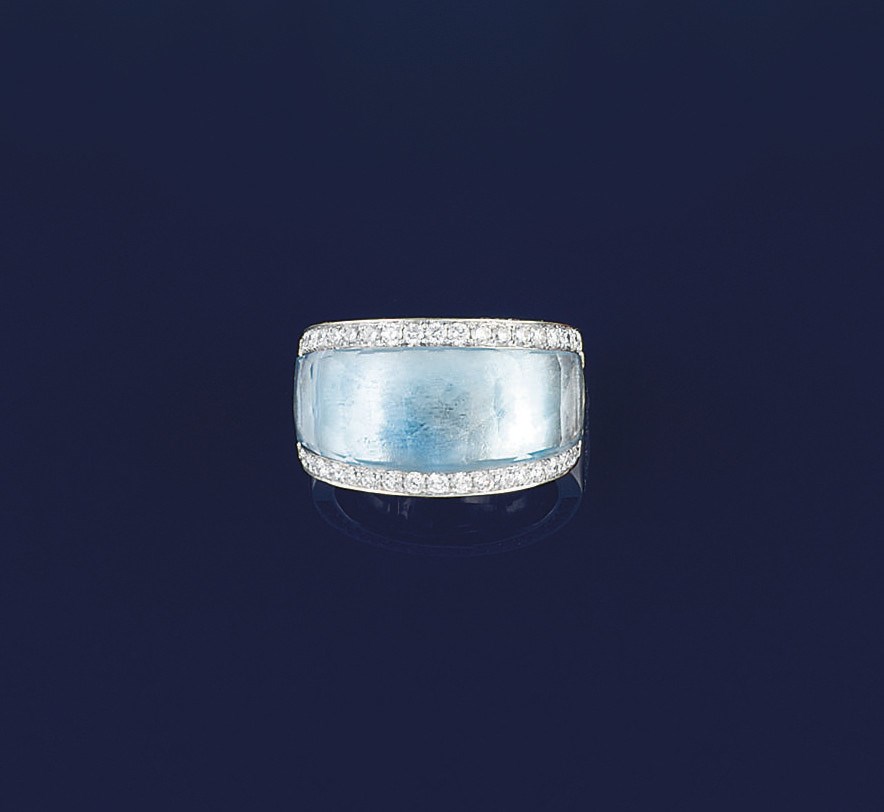 A blue topaz and diamond ring