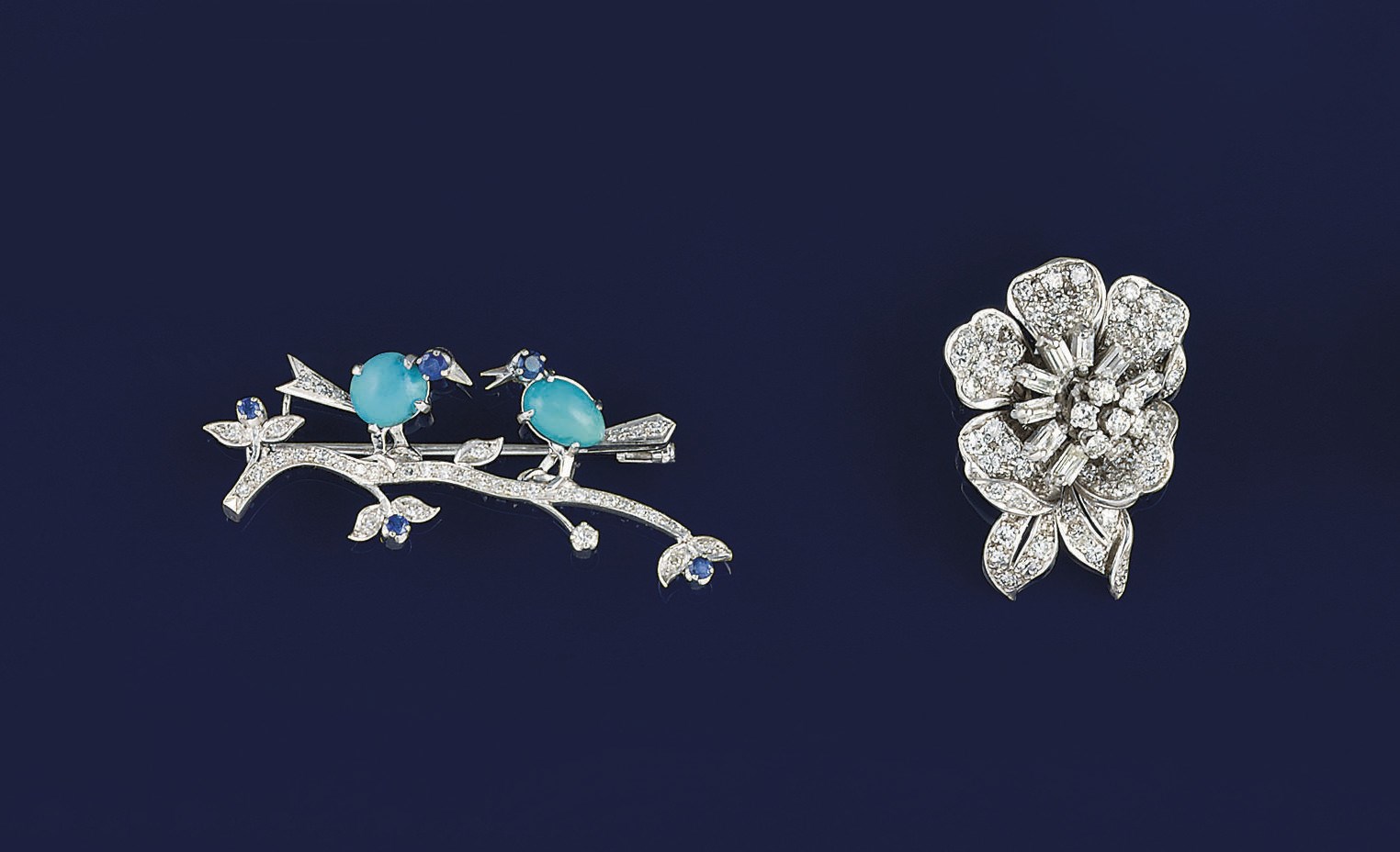 A diamond pendant and a diamond and gem brooch