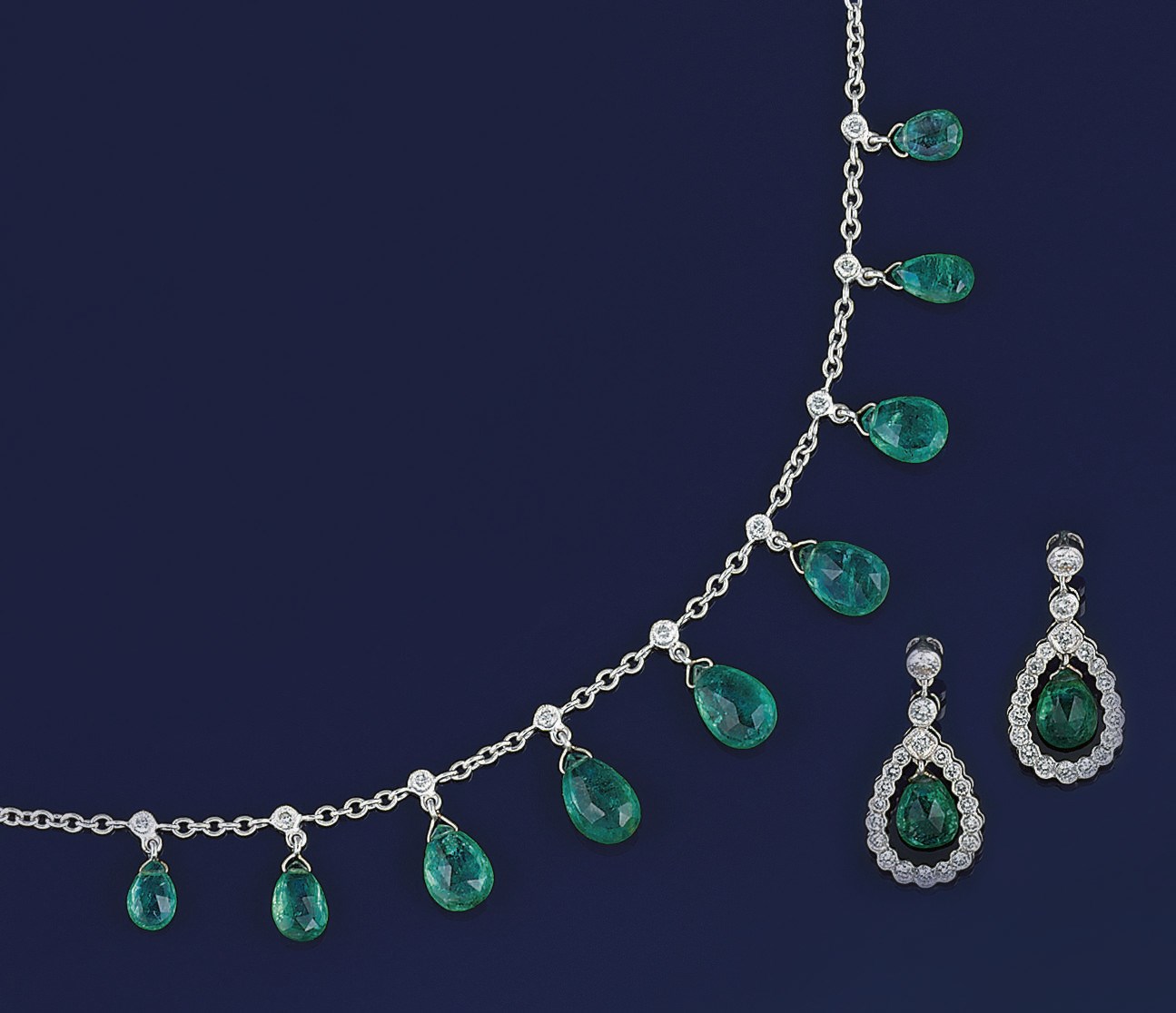 An emerald and diamond necklace and earpendants