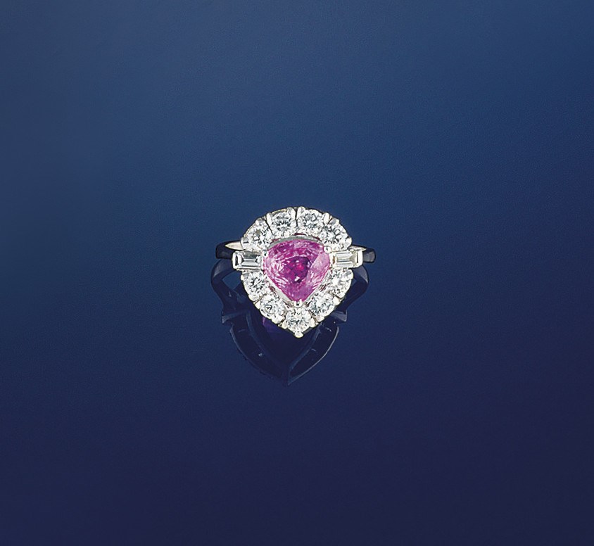 A pink sapphire and diamond cluster ring