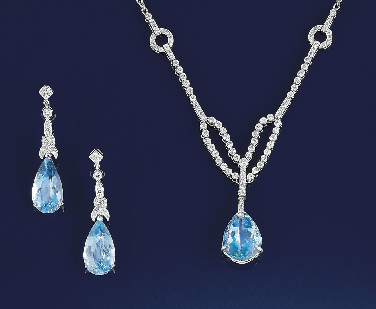 An aquamarine and diamond necklace and earpendants