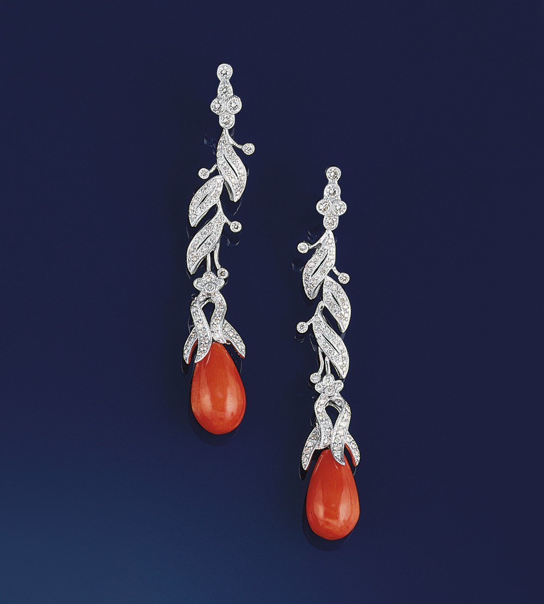 A pair of diamond and coral earpendants
