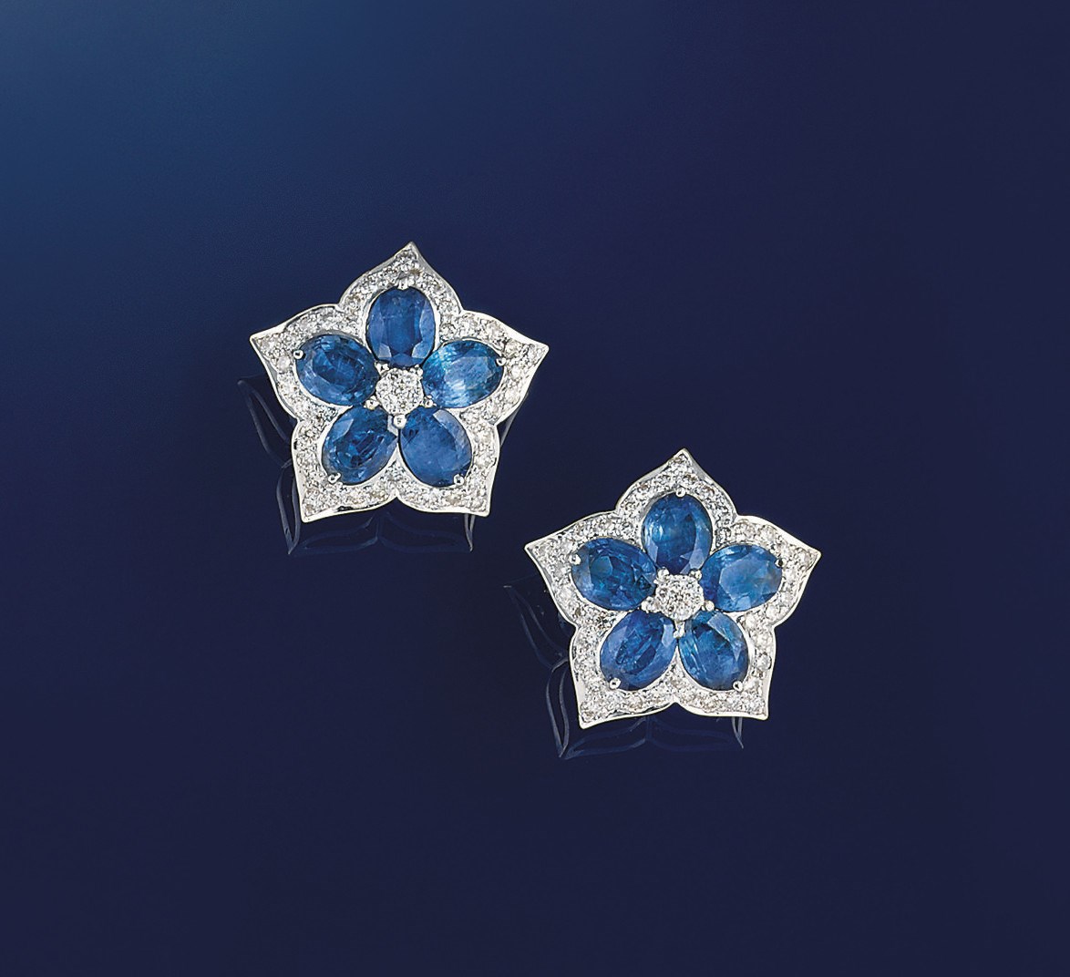 A pair of sapphire and diamond ear studs