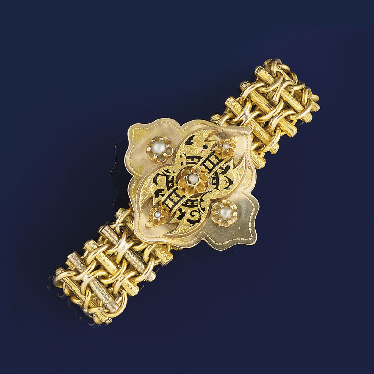 A Victorian gold enamel and pearl bracelet and a wristwatch