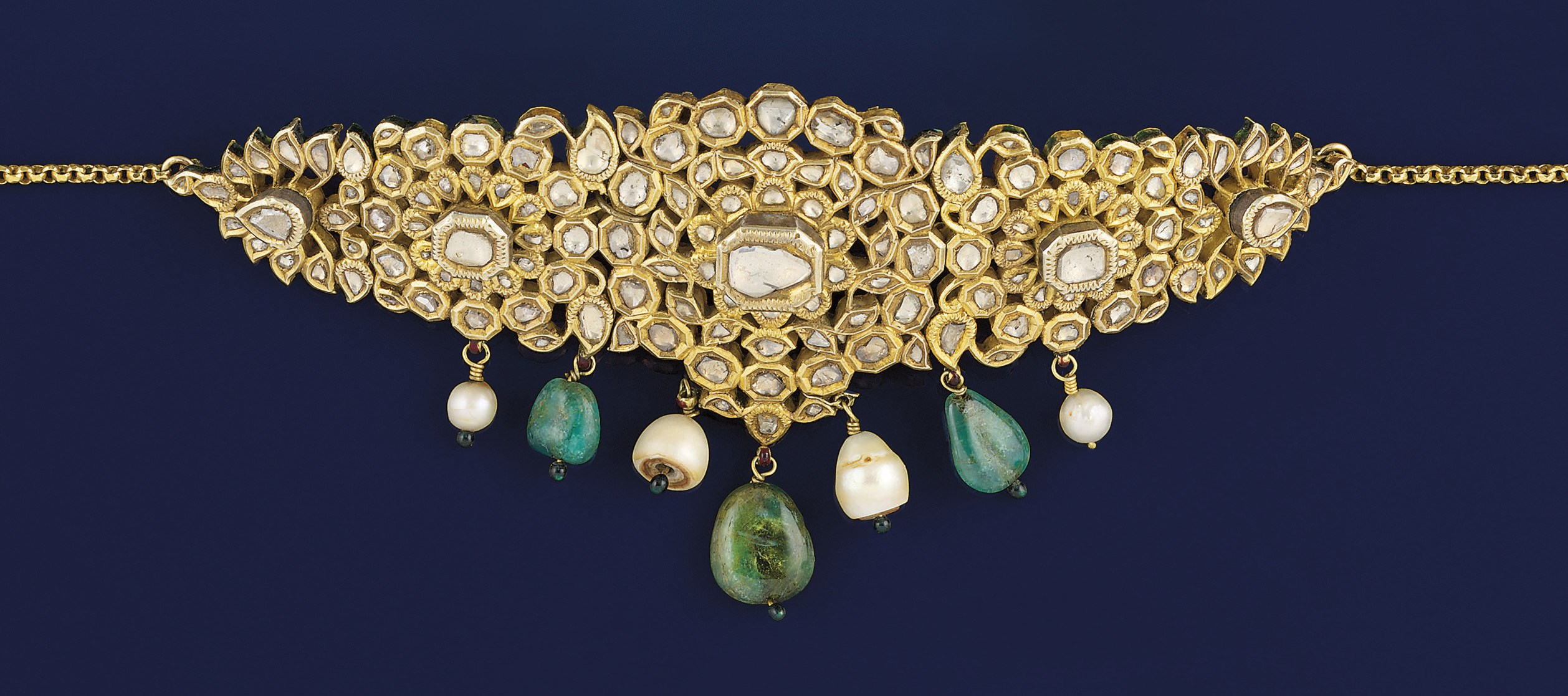 A 19th century Indian diamond, emerald, pearl and enamel bazuband