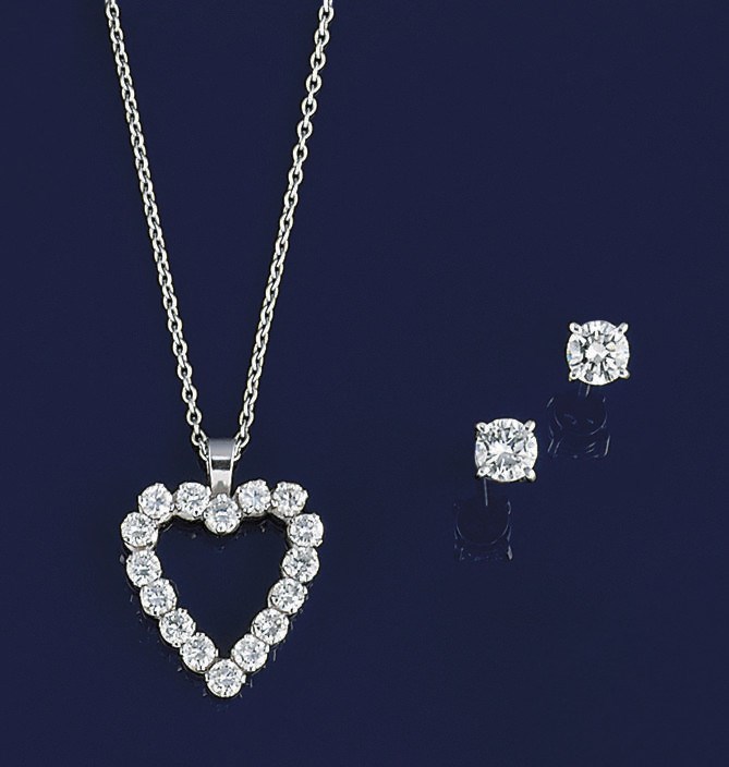 A diamond pendant, by Kutchinsky and a pair of diamond single stone earstuds