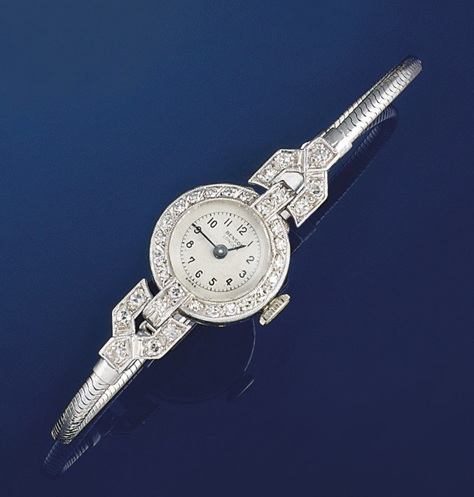 A lady's diamond wristwatch and a cultured pearl necklace