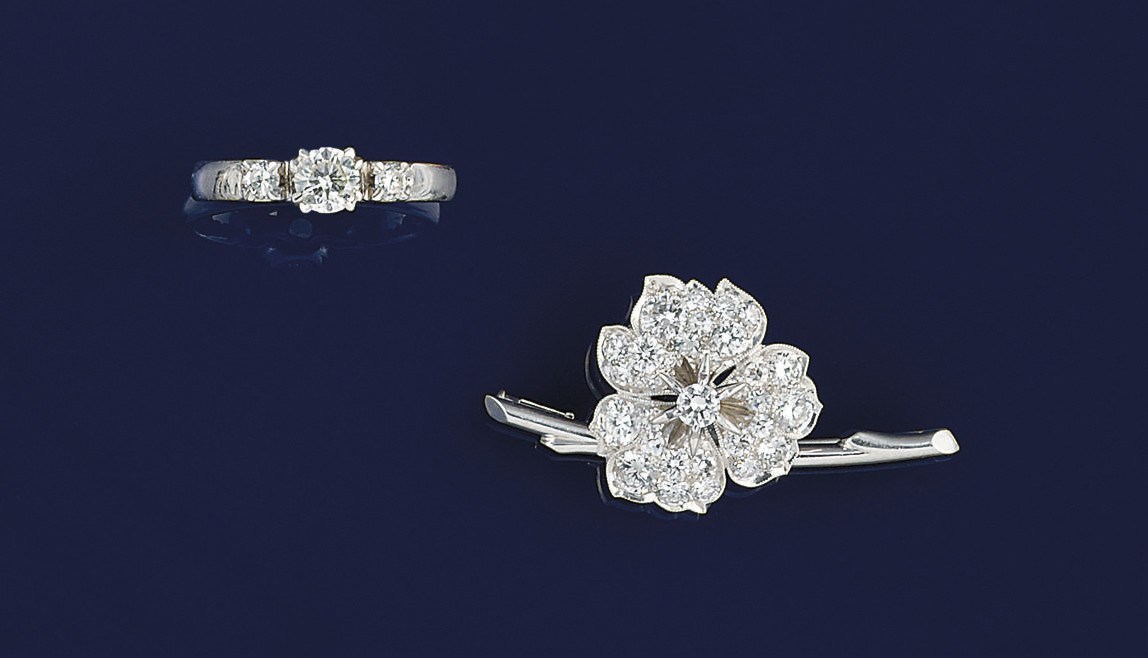 A diamond ring and brooch
