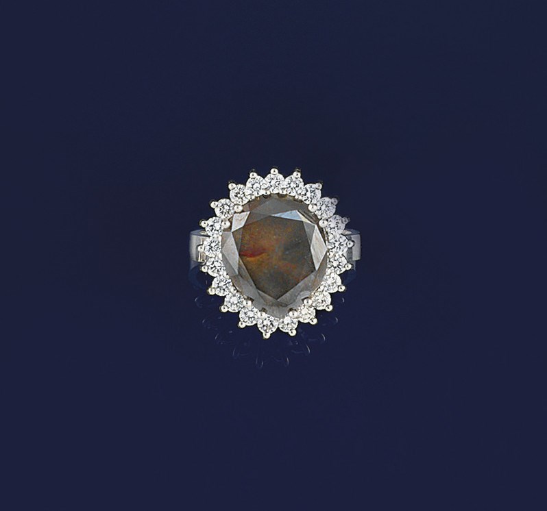 A COLOURED DIAMOND AND DIAMOND RING